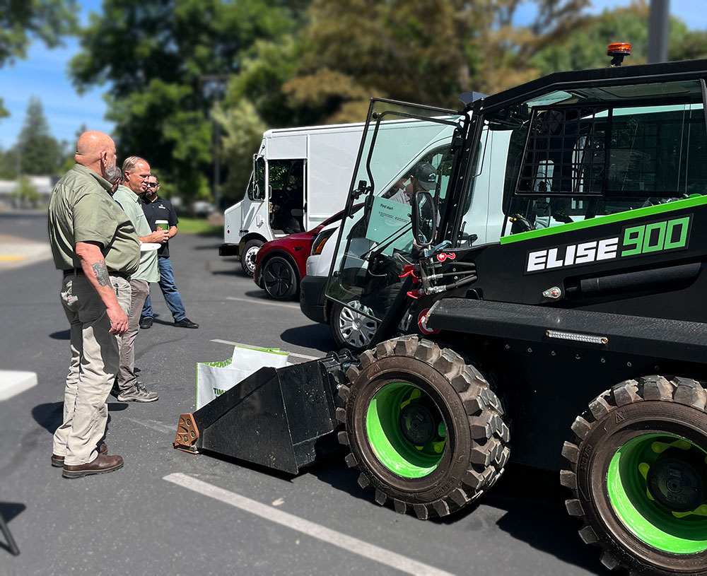 Fleet Academy event with people viewing electric vehicle fleet